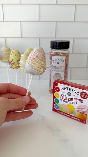 Watkins artificial dye-free Rainbow Sprinkles and Food Coloring bring a pop of color to these Easter Egg Cake Pops! | Watkins