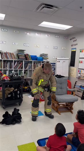 TFD’s Captain Mark Cromey stopped by Leman Academy last week to show students what a firefighter looks like when geared up to fight fires. He reminded the kids that it’s important to recognize firefighters in full turnout gear so they know not to be afraid when we show up to help. Hopefully, he inspired a few future firefighters along the way! Captain Cromey even gave the older students a hands-on lesson in how to use a fire extinguisher. | Tucson Fire Department