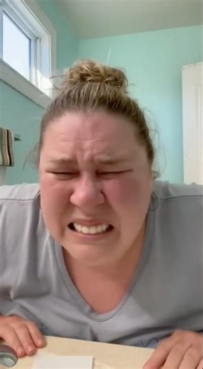 Her reaction when the explosion hits