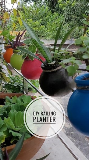 Linto Antony on Instagram: "DIY railing planter.. I have used camel fabrica acrylic paints. #diyplanter #railingplanter #railingplanters #planter #colorfulplanters #terracottaplanters #terracottapots"
