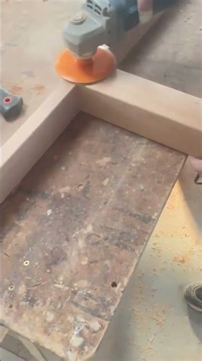 Hand Using Power Sander To Smooth Surface Of Wood