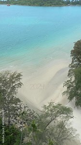 Aerial view of the year 2024 written on tropical beach. Concepts of summer 2024 or vacation 2024.
