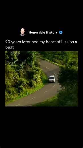Honorable History on Instagram: "The 2004 K-Fee “Car” commercial is a calculated psychological trap disguised as a relaxing video. It deliberately lulls the viewer into a deep state of calm by showing a white car gliding silently down a lush green hillside while soft, dreamy flute music plays and sunlight filters through the trees. This prolonged serene sequence triggers sensory habituation: the brain lowers its guard, heart rate slows, and the body relaxes because nothing threatening has appear
