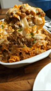 Easy Beefy Sour Cream Noodle Bake Ingredients: 12 oz egg noodles 1 lb ground beef 1 small onion, finely chopped 2 cloves garlic, minced 1 (15 oz) can tomato sauce 1 tsp Italian seasoning Salt and pepper, to taste 1 cup sour cream 1 cup small curd cottage cheese 1 cup shredded cheddar cheese 1/2 cup shredded mozzarella cheese 2 tbsp chopped fresh parsley (optional, for garnish) Non-stick cooking spray Instructions: Preheat your oven to 350°F (175°C). Lightly grease a 9x13-inch baking dish with no