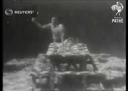 5.9K views · 119 reactions | British Pathé presents divers eating their Christmas meal underwater (1945). | Midcentury Fashion | Facebook