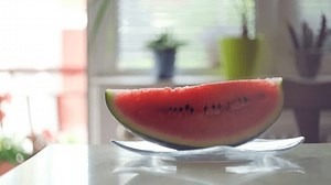 clip-3411890091-watermelon-slice-invisible-biting-kitchen-stop-motion