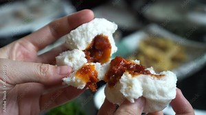 Hands open Chinese pork bbq bun dim sum bun before eating