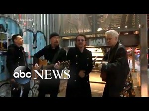 U2 performs a surprise pop-up concert on NYC street corner