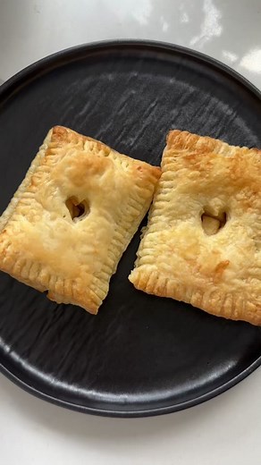 🍏 🥧 Mini hand apple pies made with puff pastry! @yourgirl_addyy So easy your kids can make it 💕 Ingredients: 2 Granny Smith apples, peeled and cubed 1/2 stick of butter 1/4 cup brown sugar 1 tsp ground cinnamon 1 sheet puff pastry, thawed 1/2 cup of butter, melted for brushing the pastries 1. Preheat oven to 375°F 2. In a medium sized skillet on med to low heat, combine butter and brown sugar until melted. Add in the cubed apples and ground cinnamon. 2. Mix well and let it simmer (while stirr