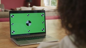 Laptop monitor with green screen and icons