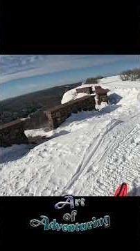 Snowmobiling up Brockway Mountain in Copper Harbor, Michigan with incredible Lake Superior views.