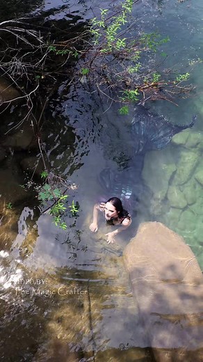 Would you get in the water with her? This black River Mermaid is looking like she's up to no good... 🙃 Video filmed in Northern Michigan. The mermaid is played by me. #blackmermaid #professionalmermaid #gothicmermaid #gothmermaid #themagiccrafter