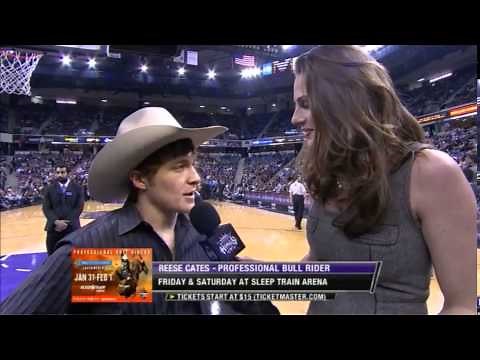 Tall Reporter Towers Over Cowboy