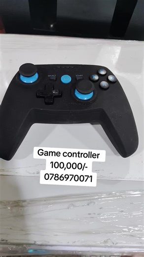 a generic or unbranded wireless game controller, likely compatible with multiple platforms such as Android, iOS, PC, and Nintendo Switch. It is a third-party accessory, not produced by major console manufacturers like Sony or Microsoft. Key Features Design: It features a black, ergonomic design similar to an Xbox controller, with blue accents around the analog sticks. Connectivity: It typically uses Bluetooth and often comes with a 2.4G wireless receiver for broader compatibility. Buttons: It ha