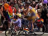 Naked cyclists bike through Seattle Pride Parade