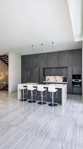 Designed by Amrin Khatoon, this stunning Dubai Hills Kaiser Kitchen is filled with savvy selections and polished materials. ⁠ ⁠ A hidden back kitchen can be found through a camouflaged entrance on the left side of the show kitchen. The active kitchen is incredibly spacious, equipped, and functional while maintaining the style of the front kitchen through the use of Comet Pearl Grey fronts from Kaiser. This space proves without a doubt that you do not have to sacrifice style for functionality.⁠ ⁠