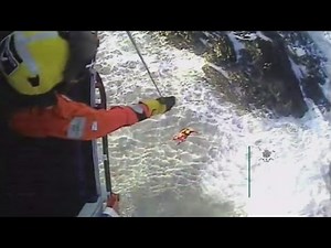 Dramatic footage of couple winched to safety after being cut off by tide