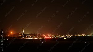 Flight takeoff and landing time-lapse video at the busy airport at night