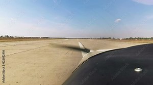 Small propeller plane are trying takeoff. View from cockpit.