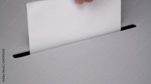 Close-up gray ballot box. Presidential and parliamentary elections. The voter throws the ballot into the ballot box.