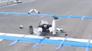 Moment marathon-runner robot trips & medical team rush over with STRETCHER