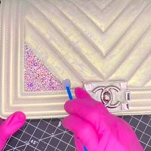 Urban Bling is a professional luxury-accessory bedazzler in New York City. Here's how it professionally bedazzles, or "strasses," Chanel bags with Swarovski crystals. | Insider Style