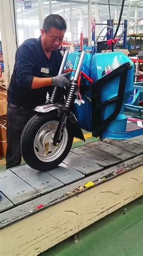 shock assembly stage in a vehicle manufacturing process made in a factory #automobile