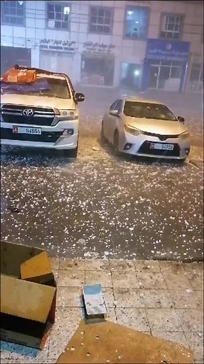 Hailstorm Night Scene with Parked Cars
