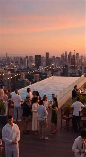 A cinematic rooftop pool scene at a luxury hotel during a lively celebration. #CinematicScene