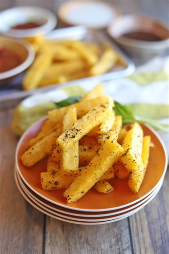 Pre-made polenta becomes crispy fries in the air fryer. Simply cut a tube of polenta into fry shapes, season, and cook. Serve with your favorite dipping sauce for an easy and tasty snack. Get the recipe: https://cadryskitchen.com/air-fryer-polenta-fries/ #airfryerrecipes #airfryer #AirFryerCooking #veganairfryer | Cadry's Kitchen