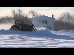 John Deere Tractor Plowing Snow