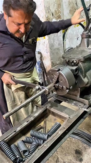 Watch the skilled hands of a master spring maker as he transforms a simple metal wire into a strong and precise spring using a manual gearbox vintage lathe and simple hand tools. A true display of old-school craftsmanship and engineering skill. 🔩⚙️ #SpringMaking #VintageMachine #MetalWork #OldCrafts #Handmade #WorkshopSkills #LatheWork #EngineeringArt #Craftsmanship #MetalWorker #TraditionalSkills #VintageLathe #HandToolWork | Creators Craft