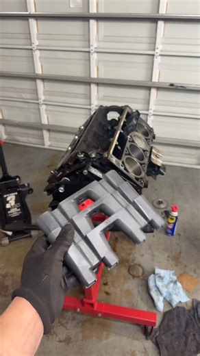 Joao Silva | Installing lifters and lifter trays onto the junkyard LS motor | Instagram