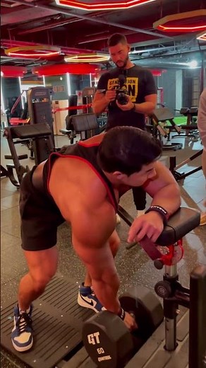 Chul Soon Hwang Performs Dumbbell Rows with Korean Bodybuilding Team