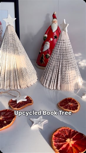 Rada | imperfect sustainability 🌿🇬🇧 on Instagram: "Upcycle an old book, magazine or a book of maps into a beautiful paper tree using this simple folding method! 🎄 It’s an easy way to add a festive touch to your decor. Will you give it a try? Follow for more simple and creative craft ideas this festive season! ✂️✨ #diychristmas #diydecorations #christmasdecorations #christmasdecor #handmadechristmas #christmasloading #christmasidea"