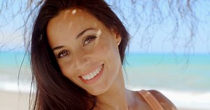 Cheerful Woman At Beach Smiling At Camera Stock Footage SBV-301274619 - Storyblocks