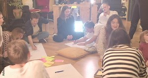 Shaping group dynamics Drawing group fosters trust cooperation among participants. Development creativity Drawing paper stimulate creative thinking participants in circle floor.