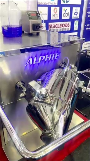 Alphie mixer with fixed drum with liquid dosing