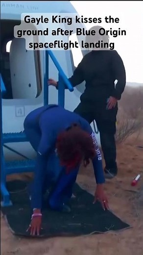 Gayle King kisses the ground after Blue Origin spaceflight landing