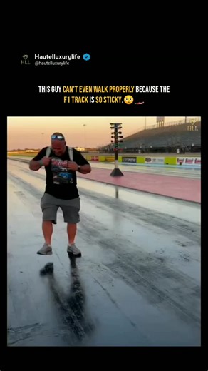 Hautelluxurylife on Instagram: "When the Track Feels More Like a Fly Trap! 🤯 ​This guy isn't just having a rough walk; this is the ultimate grip test! 😂 ​For clarification, this is not an F1 track (as the original text suggests), but a Drag Racing Strip. ​💡 Why is it so sticky? ​To give the tires maximum traction for explosive starts, drag racing tracks are prepped with a special Traction Compound (often called Track Glue or TrackBite). This compound is so strong that you literally have to st