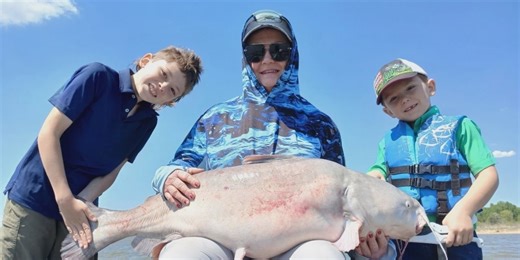 Great Catch! Two young anglers reel in 50-pound catfish on Lake Texoma