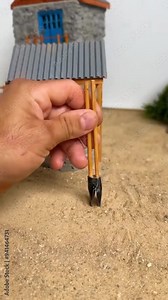 Man making a handmade mini and tiny house. Miniature house created by a man video.