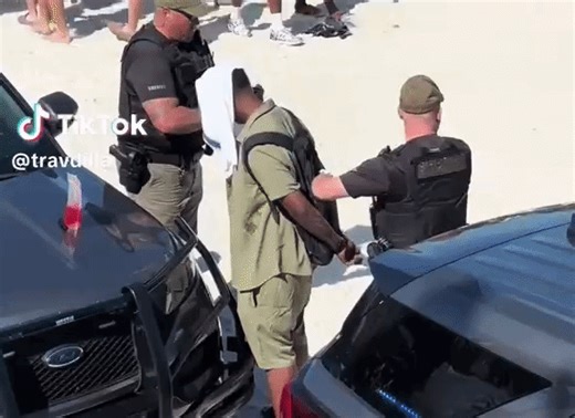 Police Patrol Crowds of Spring Breakers on Daytona Beach
