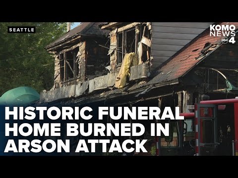 Suspect seen on camera apparently setting historic funeral home on fire
