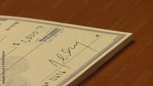 Writing a Bank Check, signing a bank check