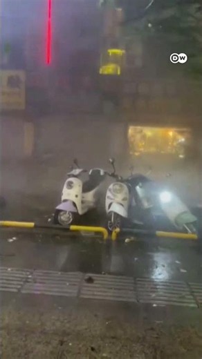 Half-built building turns into a massive waterfall [Typhoon Maysak triggers flooding at construct...