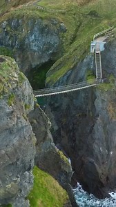 Check out this drone shot of the Carrick-a-Rede Rope Bridge 🤩🌁 @thedronecreative 💡The Carrick-a-Rede Rope Bridge is a rope bridge near Ballintoy in County Antrim, Northern Ireland. The bridge links the mainland to the tiny island of Carrickarede. It spans 20 metres and is 30 metres above the rocks below. The bridge is mainly a tourist attraction and is owned and maintained by the National Trust. When are you planning on visiting Ireland? #discoverireland #irelandtravel #visitireland #causeway