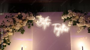 the inscription is better together on the wall of the wedding table in the restaurant