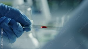 Close Up Macro Footage of a Scientist in Gloves Using Micro Pipette and Pouring Red Chemical Liquid on a Microscope Sample Plate. Microbiologist Working in Laboratory with Technological Equipment.