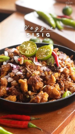 Veggie Sisig Recipe ⬇️ Ingredients: 400g firm tofu (thawed and pressed after freezing) 1 tbsp low sodium soy sauce 2 tbsp cornstarch 2 tbsp olive oil Air fry at 200°C for 10-12 minutes Sauce: 2 tbsp low sodium soy sauce 1 tbsp vegetarian oyster sauce 3-6 pcs calamansi juice or 1/2 lemon juice salt and pepper to taste 2 tbsp water Other Ingredients: 5 cloves garlic 1 white onion 1 red onion 1 stalk scallion 1 green chili 100g shiitake mushrooms 2 tbsp olive oil 2 tbsp vegan mayonnaise #sisig #veg
